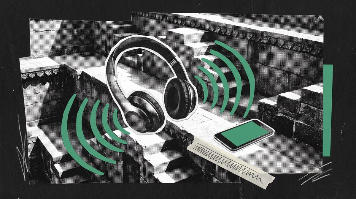 A black-and-white cutout of a pair of modern wireless headphones resting on the carved stone steps of an ancient Indian stepwell, sunlight falling across the geometric stairs.