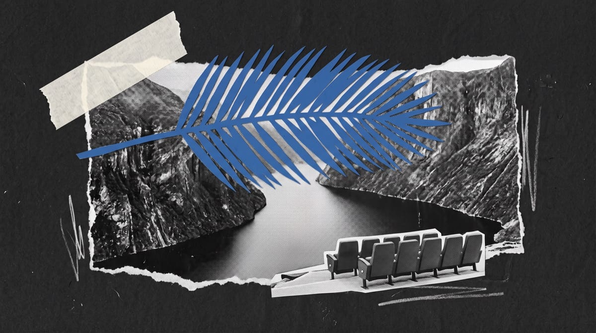 A torn black-and-white strip of a steep fjord with sheer rock walls and still dark water.