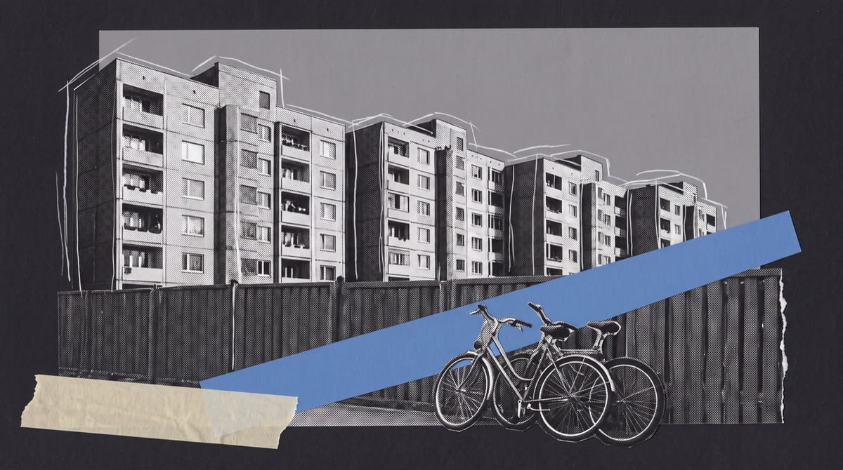Collage of grey prefab apartment blocks in a small town, with two bicycles leaning on a playground fence crossed by a strip of blue evening light.