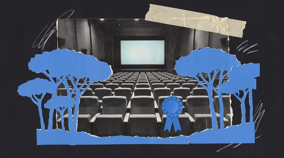 Paper collage of an empty concert-hall auditorium facing a glowing screen, framed by blue cut-paper umbrella pines, with a blue ribbon rosette pinned to a front-row seat.